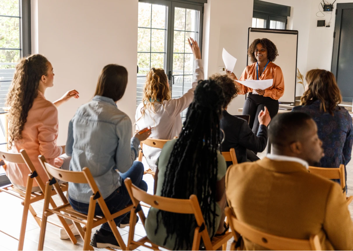 People attending a seminar in a classroom.