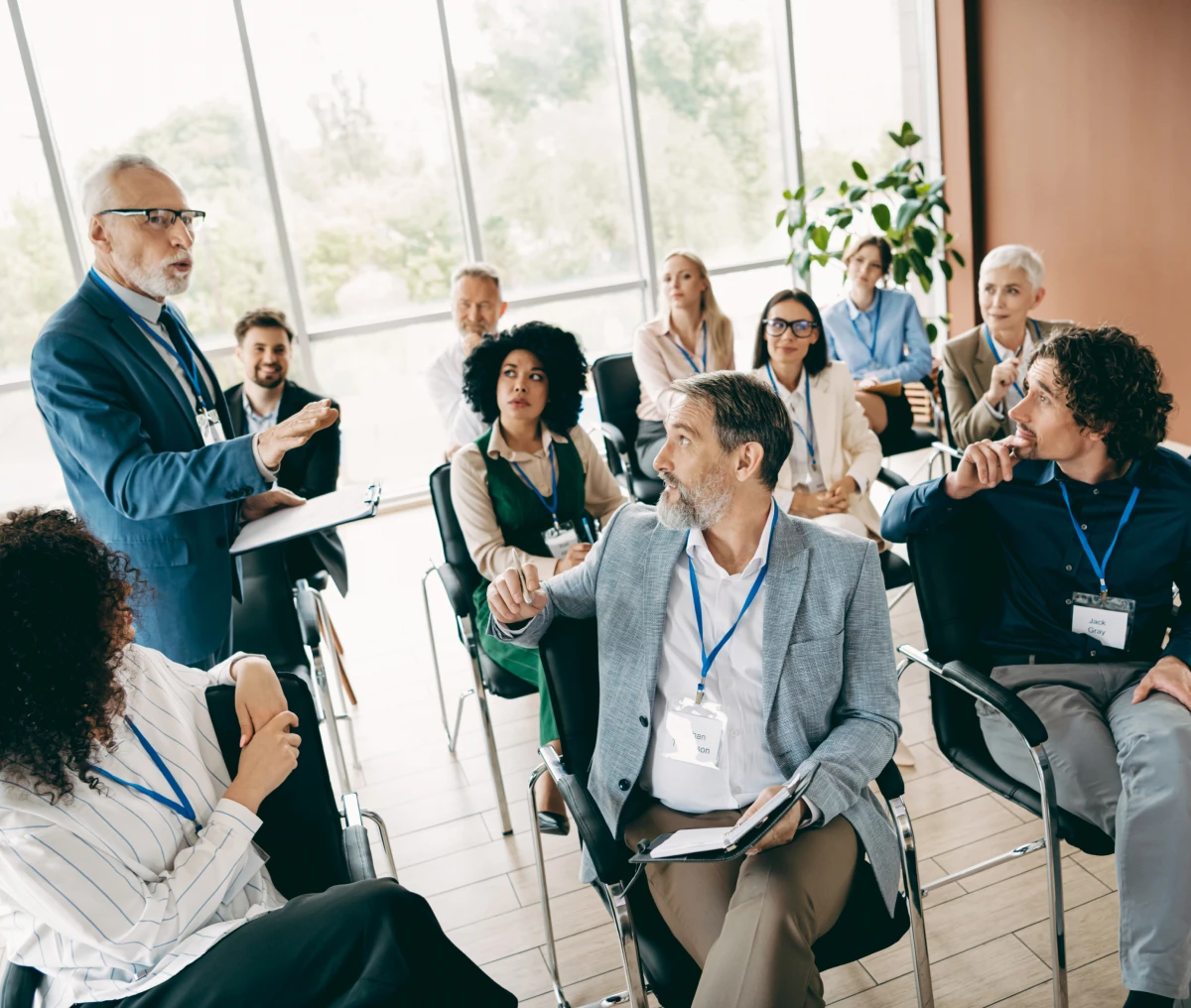 Professional seminar attendees listening attentively