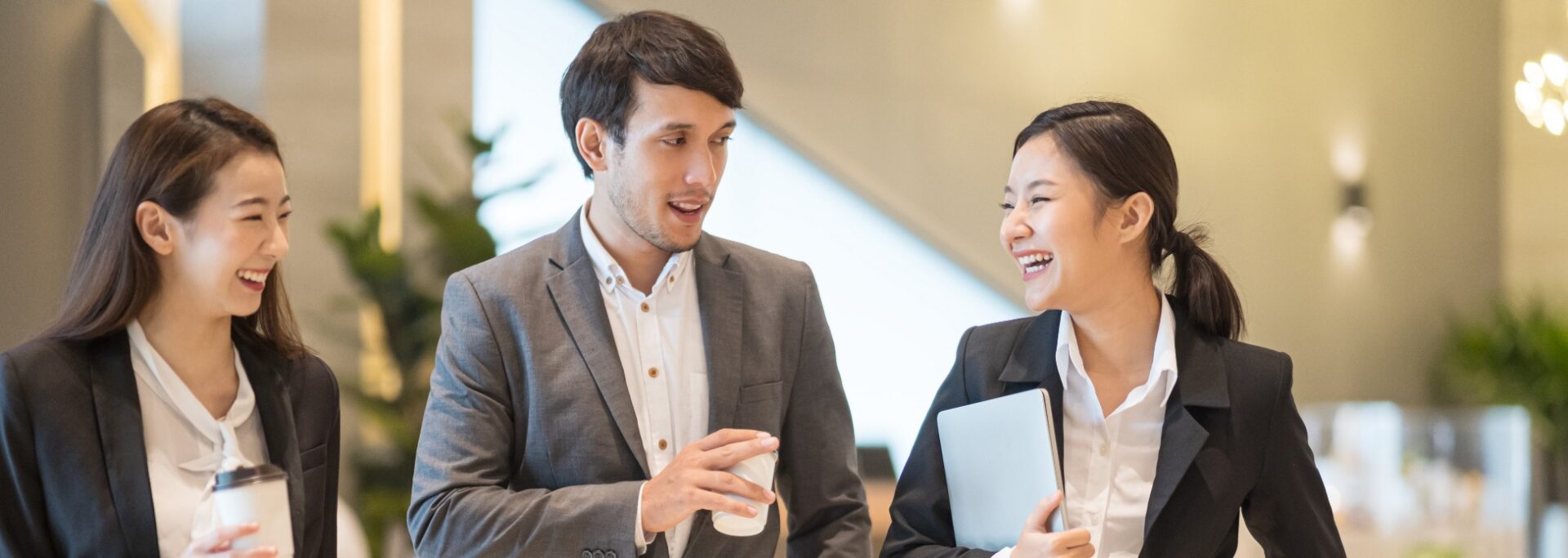 Business professionals talking and laughing