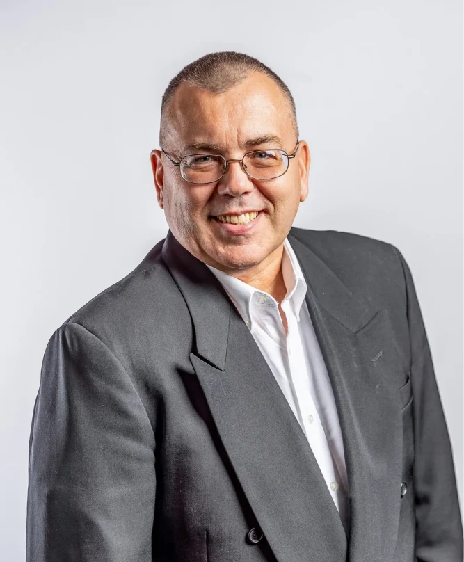 Man in suit smiling confidently