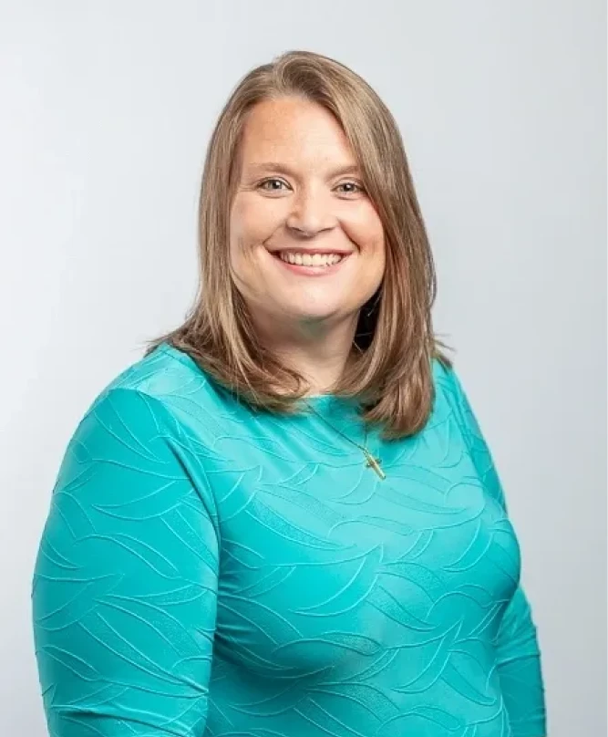 Woman with brown hair smiling